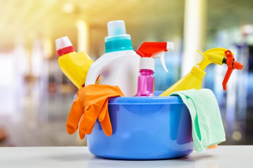 Domestic cleaner tidying a flat in E8