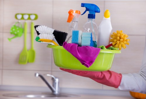 Cleaner following safe procedures in a busy cleaning environment